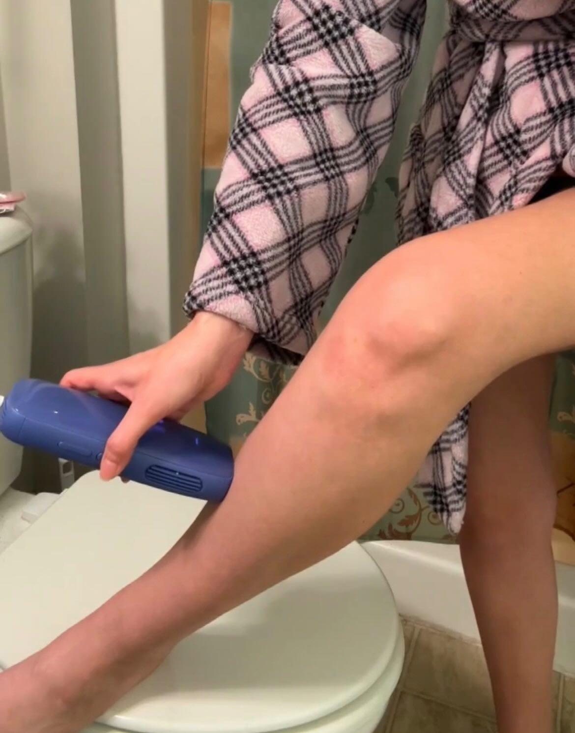Customer using the device on her leg